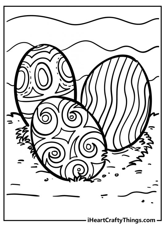 Easter Egg-themed printable picture featuring three different design eggs sitting in a patch of grass outside
