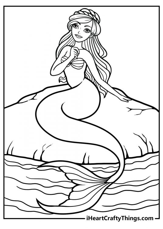 Printable coloring page for adults presenting a mermaid sitting on top of a rock near water