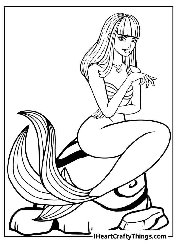 Free printable pdf of a mermaid with hair cut into bangs featured sitting on a rock