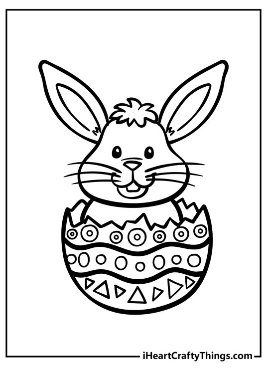 Excited Easter Bunny with long ears and whiskers emerging from a patterned Easter egg free coloring pdf