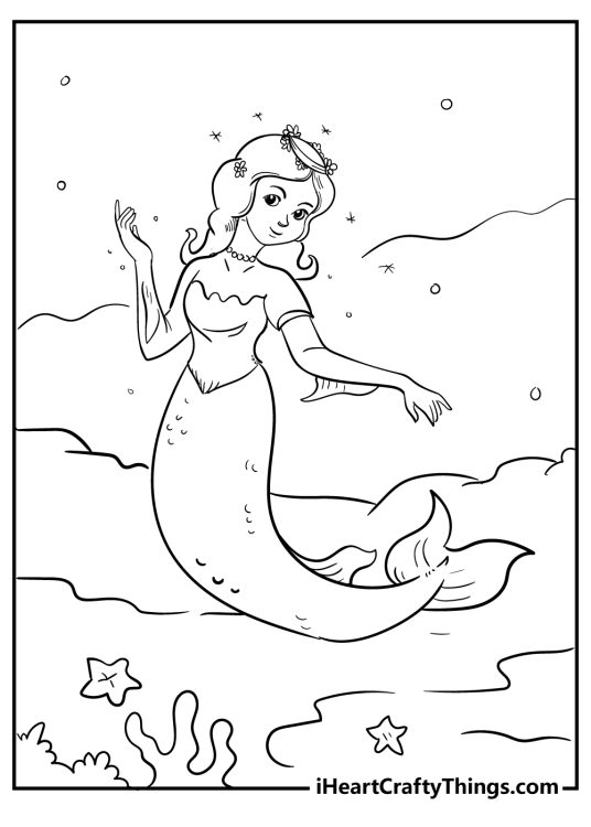 Picture of a lovely mermaid featured under water surrounded by corals, starfish and water bubbles