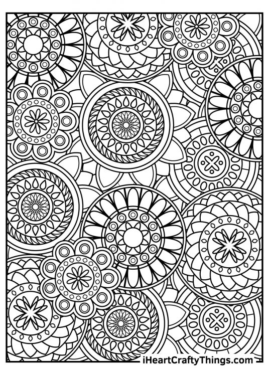 Detailed stress relief coloring page for adults featuring multiple mandala patterns all over the page