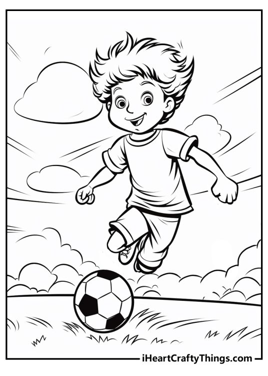 Soccer-themed image featuring young happy-looking boy kicking a ball with all his might