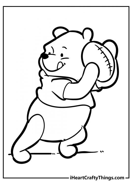 Winnie the Pooh printable coloring sheet presenting concentrated Winnie in football action