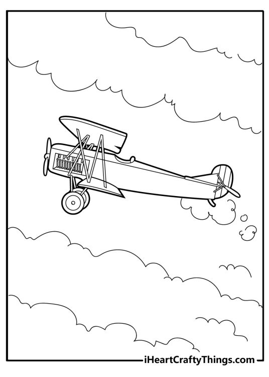 Printable image for kids of a light antique airplane flying through fluffy clouds