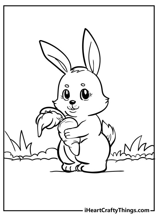 Peter Rabbit-inspired picture of a cute baby rabbit holding a big carrot with grass in the background