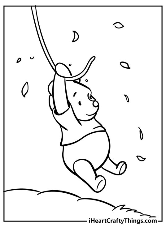 Coloring image presenting Winnie the Pooh swinging on a vine with leaves floating around him