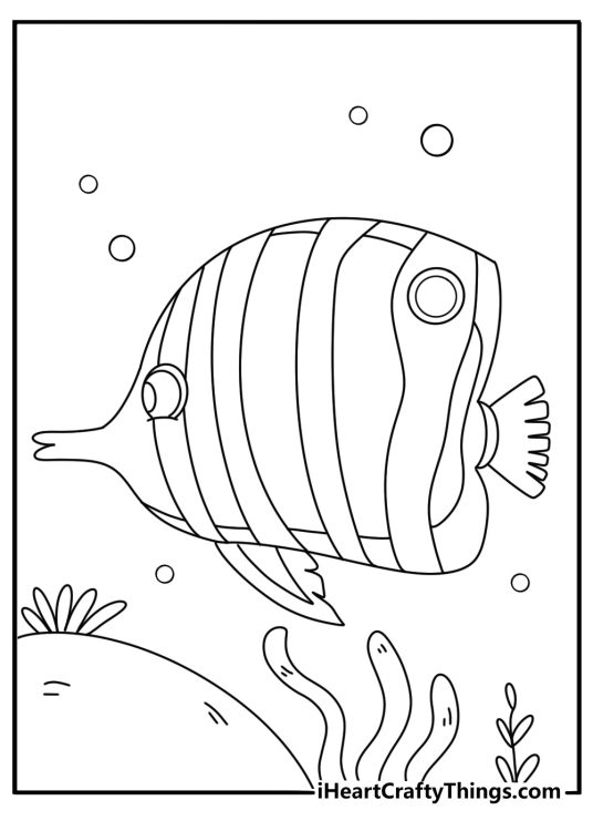 Printable fish coloring sheet with tropical fish near coral cave