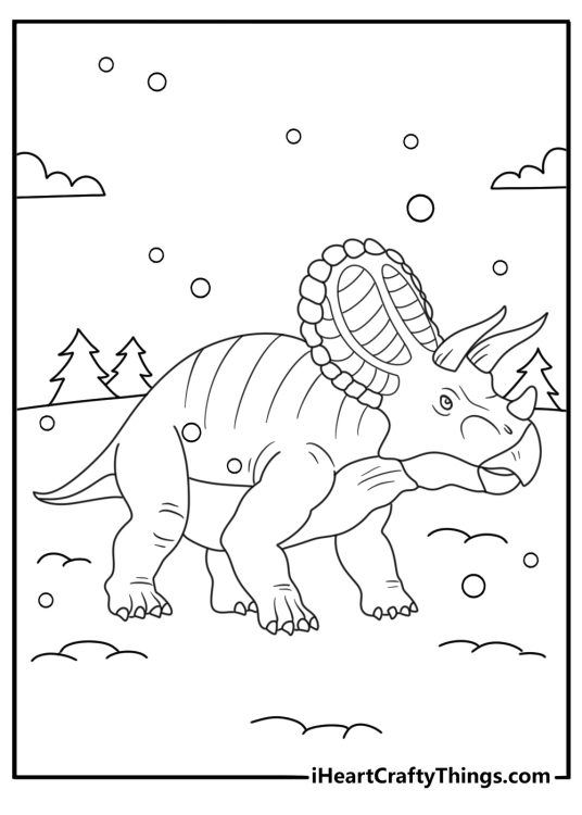 A winter dinosaur coloring sheet shows a triceratops in falling snow
