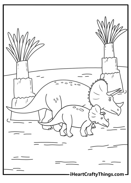 A young triceratops follows an adult through tall cycads
