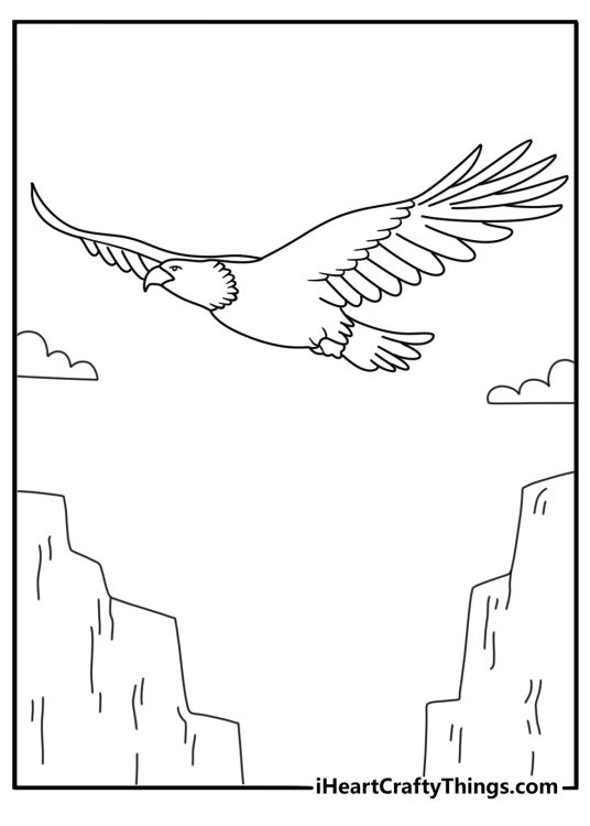 Printable bald eagle coloring page with an eagle soaring above canyon rocks
