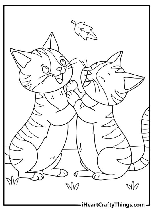 Two playful kittens chase fallen leaves in this cute coloring printable