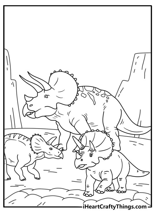 Two triceratops guard their young beside a nest
