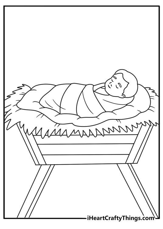 baby jesus sleeps in a wooden manger filled with soft hay