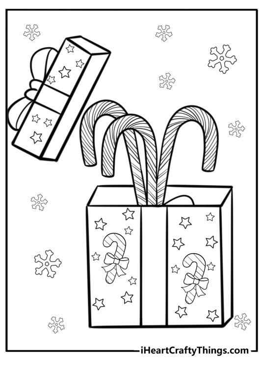 Free printable picture of an opened Christmas present with three candy canes inside surrounded by snowflakes