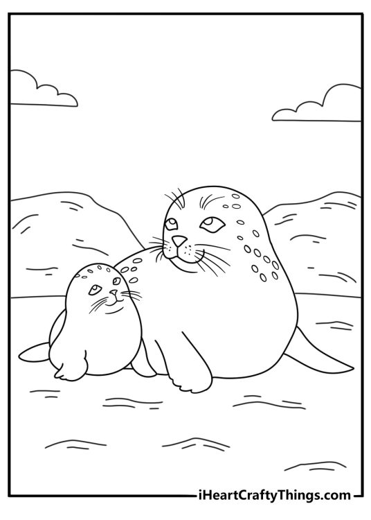 Baby seal coloring page with pup curled near mother on shore