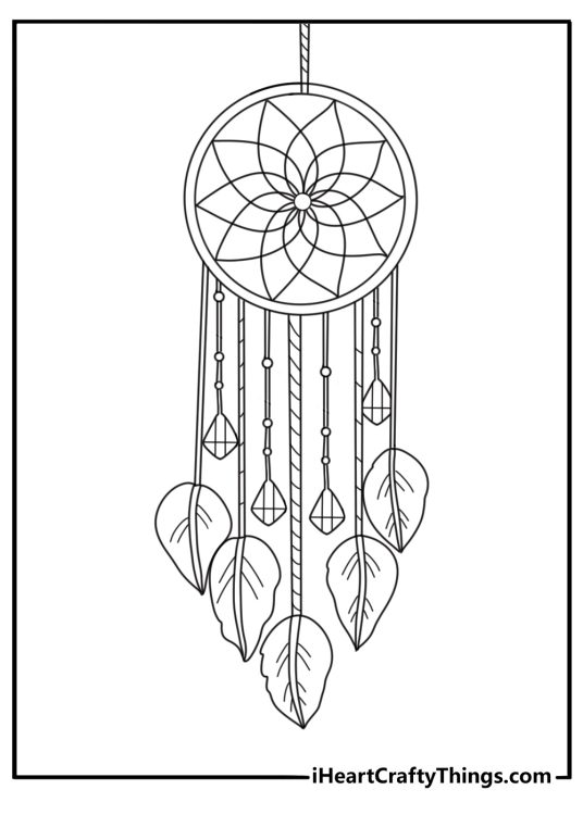 Black and white image presenting traditional dream catcher with a woven mandala decorated with beads