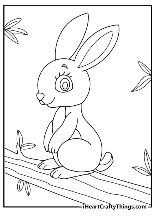 Coloring page for kids of a cute rabbit with long ears sniffing at the branches of a tree