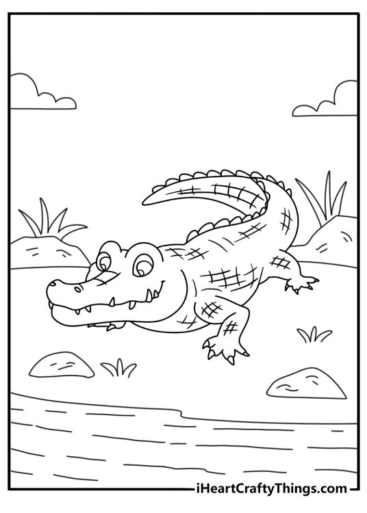 Crocodile coloring page with a large reptile resting on a riverbank