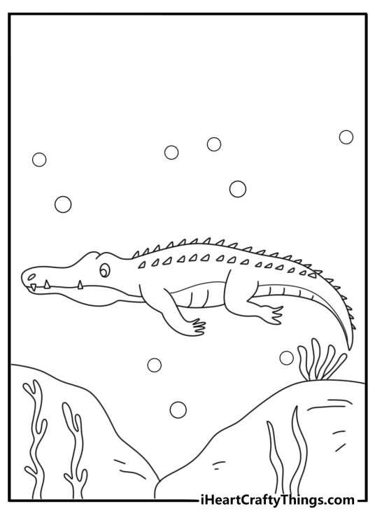 Crocodile coloring sheet with a reptile sliding into deep water