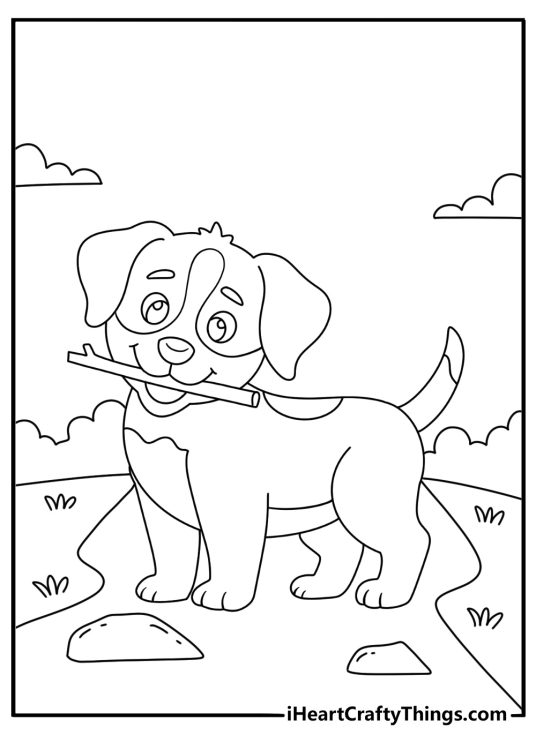 Free dog printable with a puppy carrying a small stick along a trail