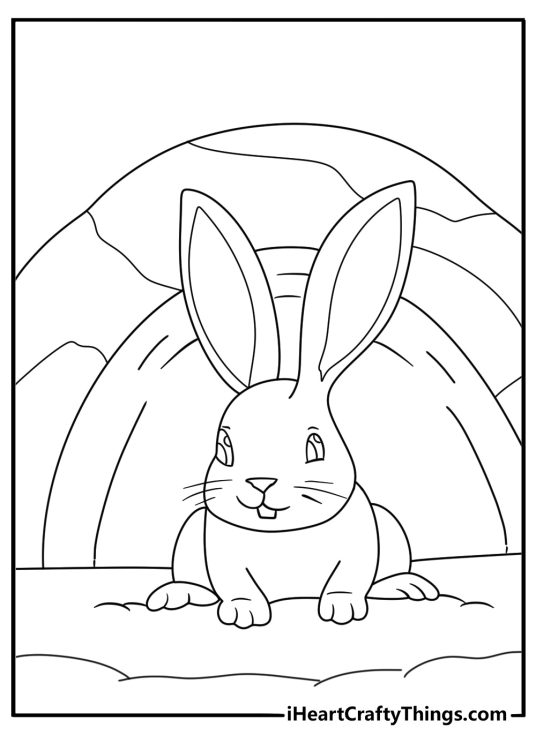 Free printable coloring page depicting happy looking rabbit relaxing in his underground burrow