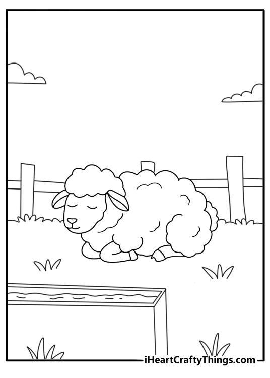 Free printable of a baby sheep resting beside a watering trough