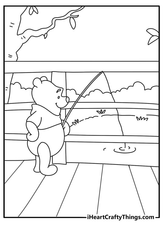 Pooh Bear fishing beside wooden bridge in Hundred Acre Wood printable coloring sheet