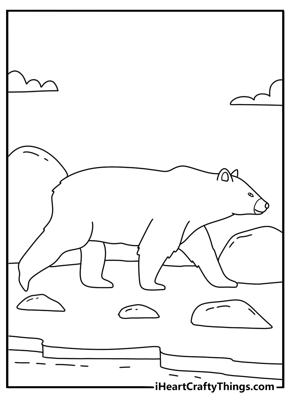 printable polar bear scene featuring a bear walking along a rocky beach