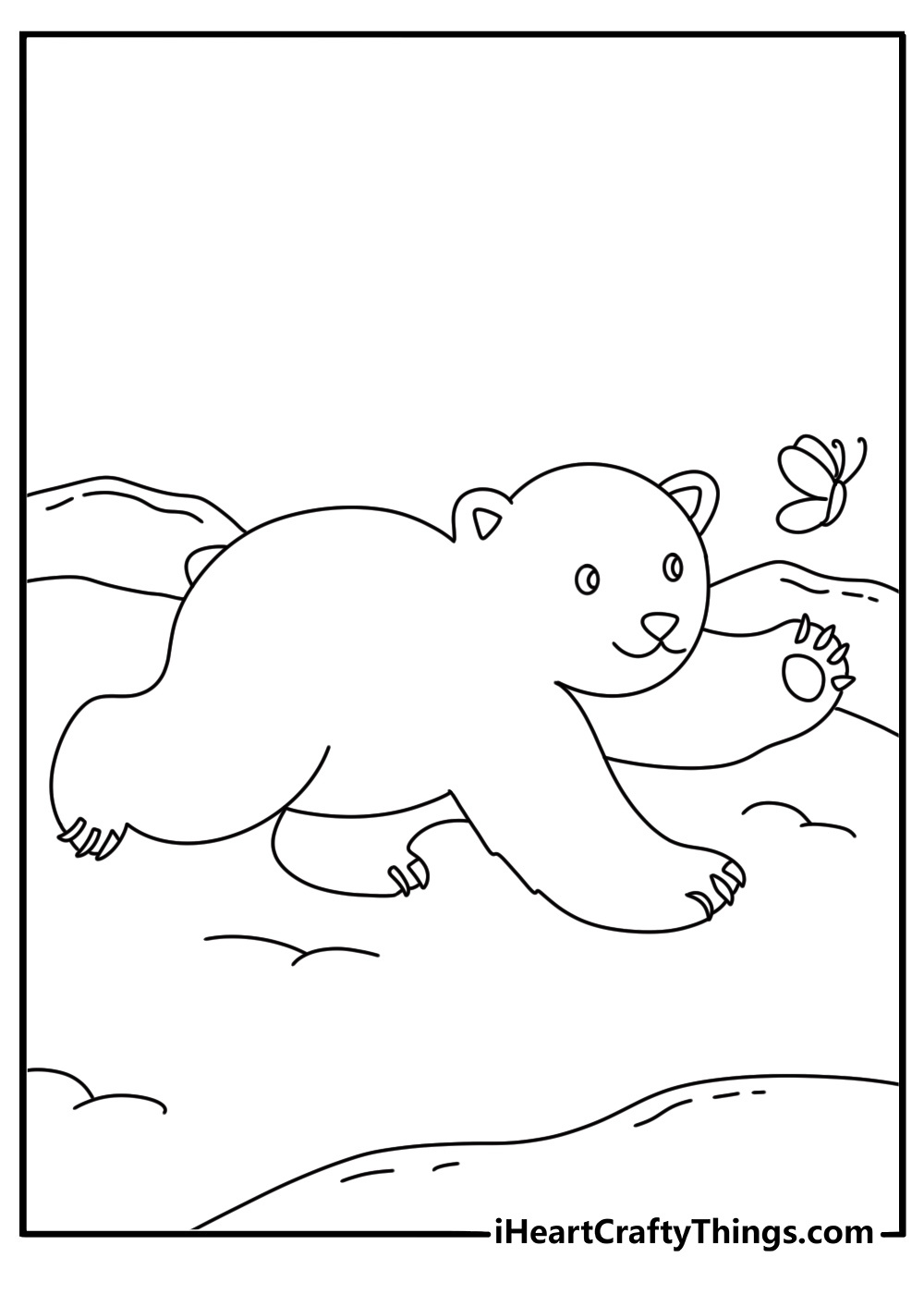 young polar bear follows a butterfly across the arctic tundra