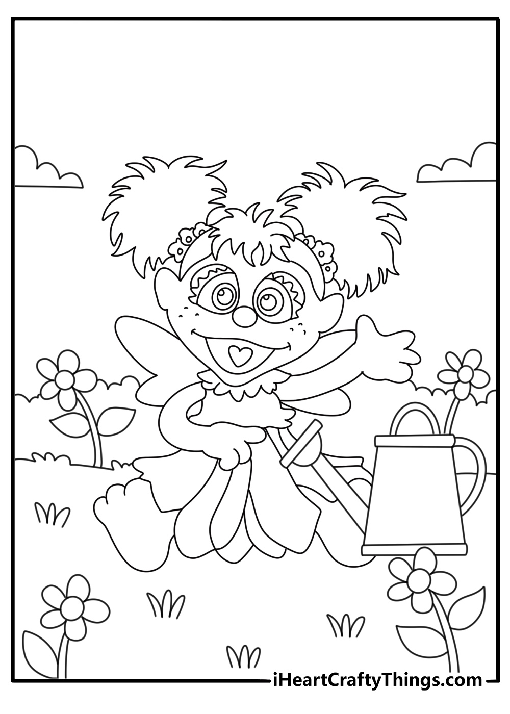 A small garden watering can sits beside Abby and blooming plants