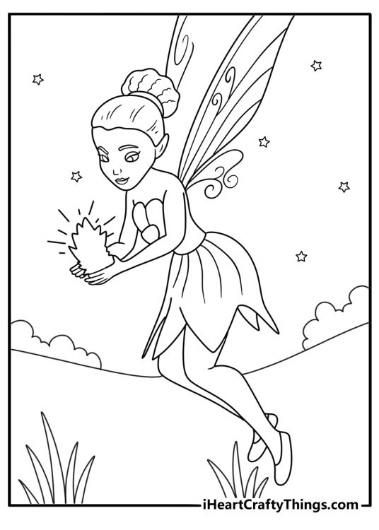 Free fairy printable featuring Iridessa making light glow from a lantern