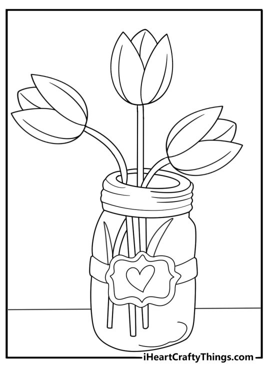 Glass jar with fresh cut tulips on table printable