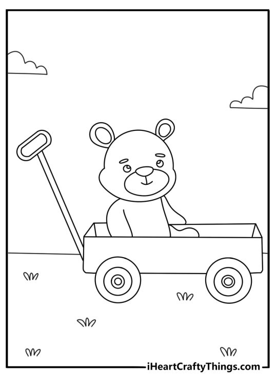 Printable teddy bear coloring page with a teddy bear riding in a wagon