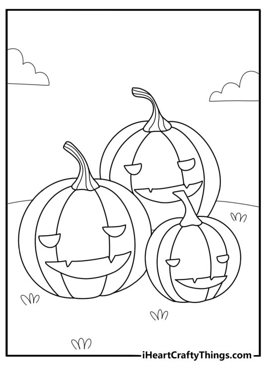 Pumpkin themed picture presenting three laughing different size pumpkins laying on the grass
