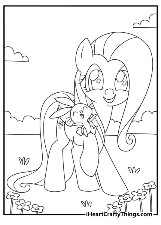 My Little Pony coloring page of Fluttershy caring for a small rabbit in a garden
