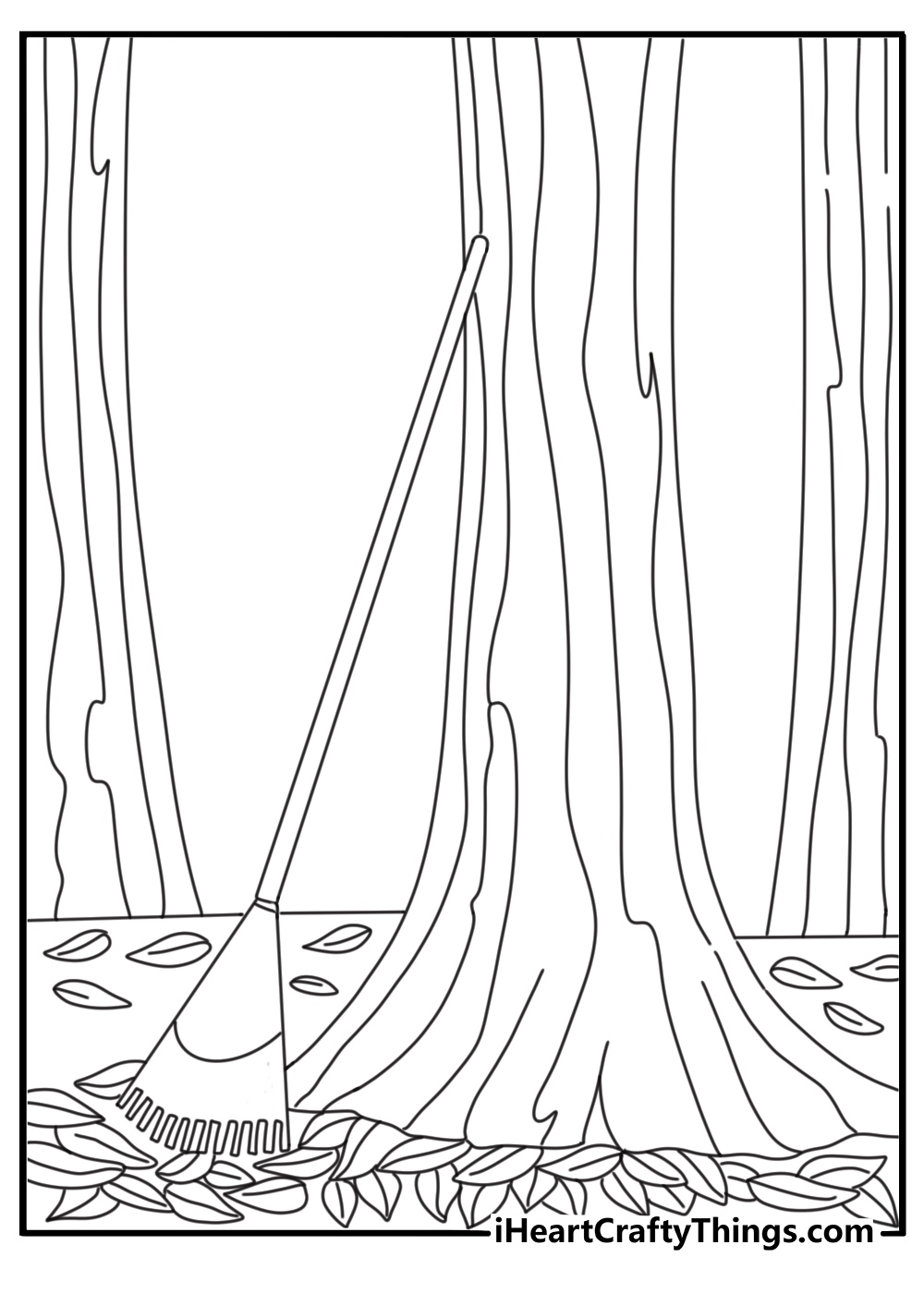 rake leaning against tree