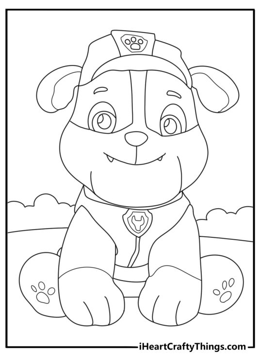 Free Paw Patrol coloring page showing smiling Rubble with a paw emblem on his hat