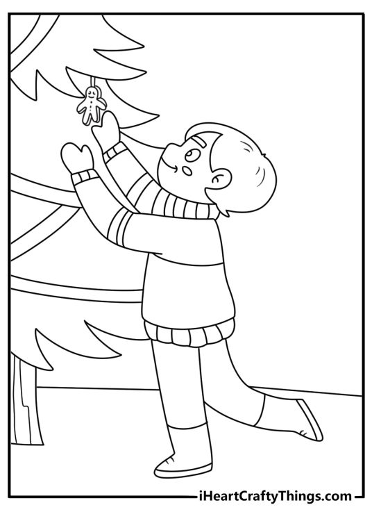 Free printable featuring a child hanging a wooden ornament on the branches