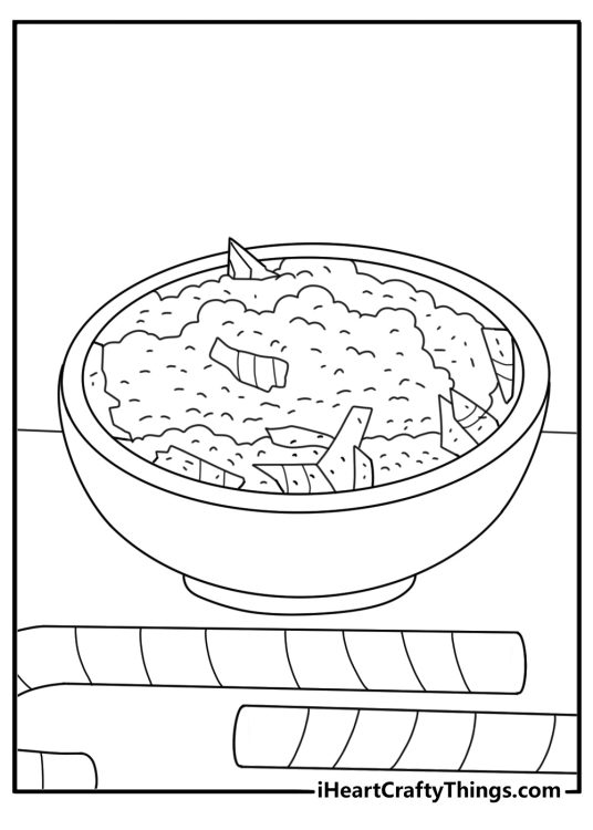 candy cane rests beside a bowl of crushed peppermint pieces