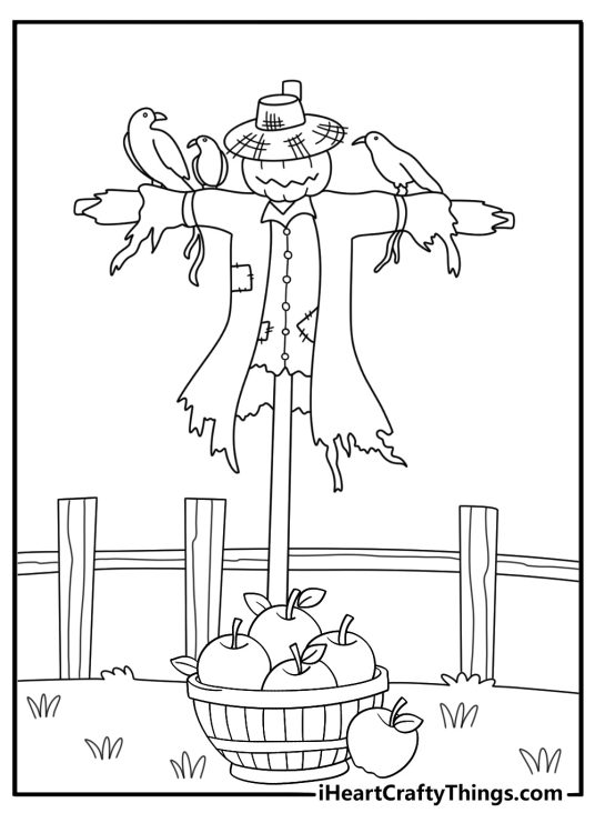 Printable harvest page showing a scarecrow beside baskets of apples