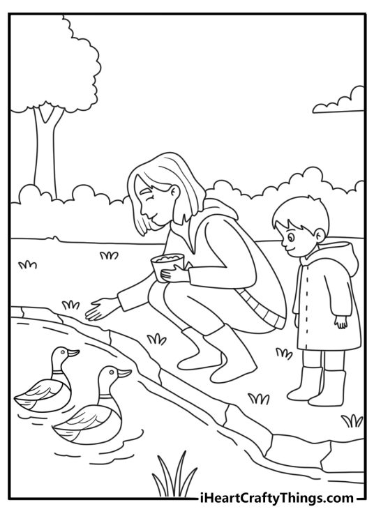 A mother and son feed ducks beside a pond in this coloring sheet