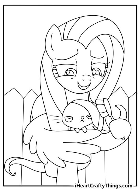Free Fluttershy printable of Fluttershy brushing a bunny near a fence