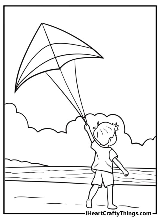 Kite soaring over a beach fun coloring sheet for kids