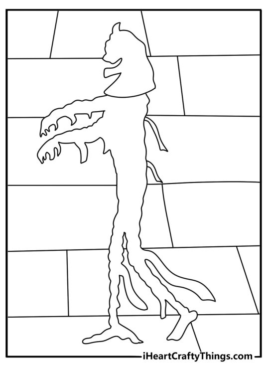 A spooky mummy shadow appears on a pyramid wall in this coloring sheet