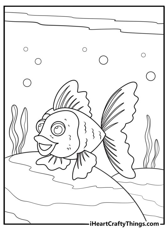Goldfish resting near smooth rocks at the bottom coloring page