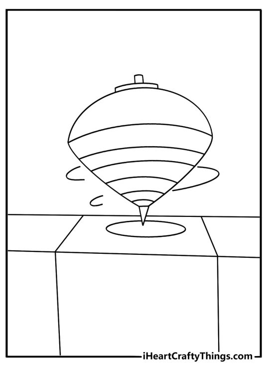 Free toy printable of a spinning top beside toy blocks