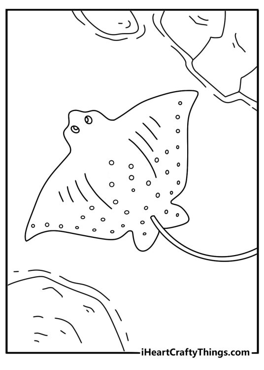 Stingray coloring pages scene of a ray near a rocky tide pool