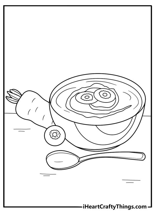 carrot soup in a bowl with spoon food coloring sheet
