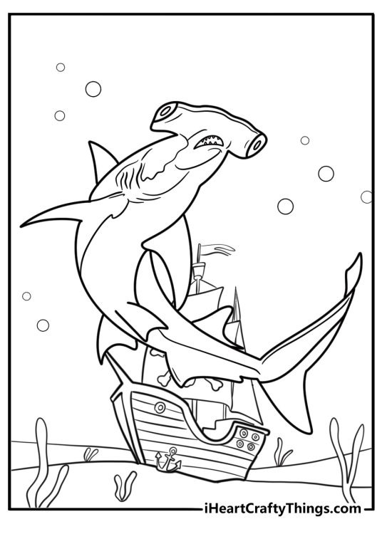 Hammerhead shark near sunken ship coloring page